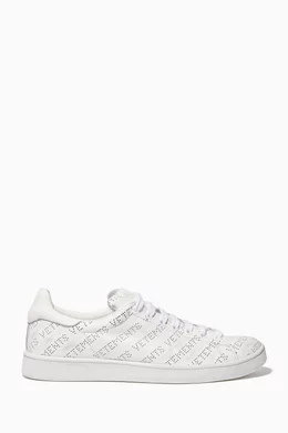 Buy Vetements White Perforated Logo Low Top Sneakers for Women in