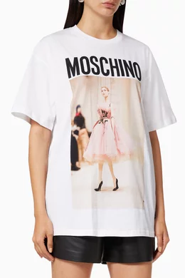 Buy Moschino White Fashion Show Puppet Logo Cotton Oversized T shirt for Women in UAE Ounass