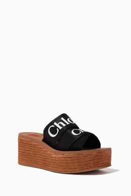 Buy Chlo Black Woody Wedge Mules in Canvas for Women in UAE Ounass