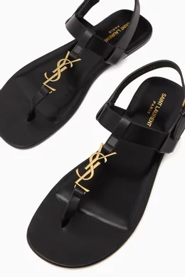 Buy SAINT LAURENT Black Cassandre Flat Sandals in Smooth Leather for Men in UAE Ounass