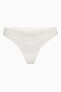 Buy SKIMS White Fits Everybody Lace Dipped Thong for Women in UAE