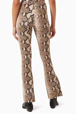 Buy Stella McCartney Brown Python print Flared Pants in Stretch Recycled nylon for Women in UAE Ounass