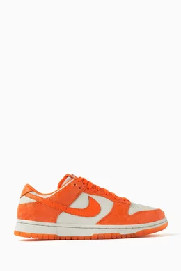 Orange and white best sale nikes