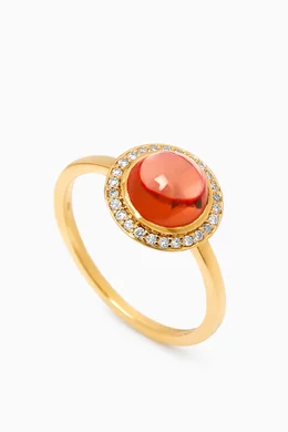 Gold ring with top garnet