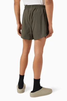 Buy Fear of God Essentials Grey Running Shorts in Stretch Woven