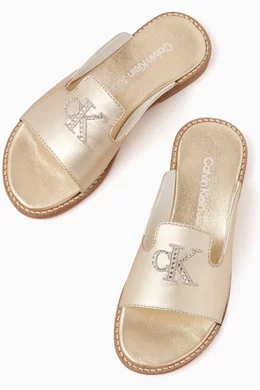 Buy Calvin Klein Gold Logo Slip on Sandals in Metallic leather for Girls in UAE Ounass