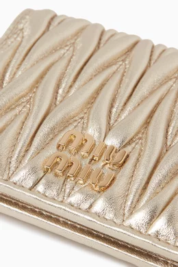 Buy Miu Miu Gold Small Flap Wallet in Matelassé Nappa Leather For