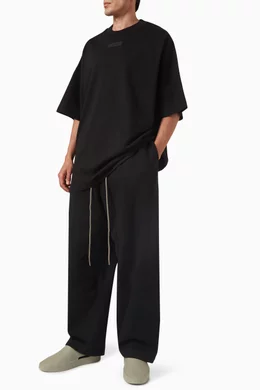 Buy Fear of God Essentials Black Lounge Pants in Core Fleece For