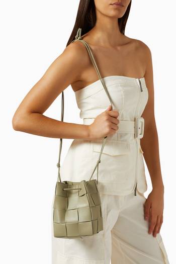 hover state of Small Cassette Bucket Crossbody Bag in Intrecciato Leather
