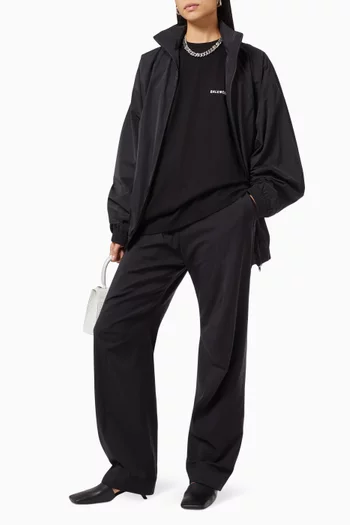 تي شيرت قطن جيرسيه بقصة واسعة وشعار الماركة