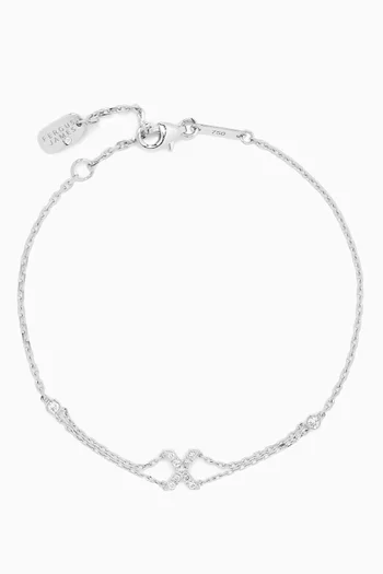 سوار بحلية حرف X مرصع بالماس ذهب أبيض عيار 18