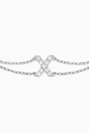 سوار بحلية حرف X مرصع بالماس ذهب أبيض عيار 18