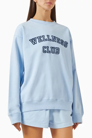 سويت شيرت بطبعة Wellness Club‏ بارزة الملمس