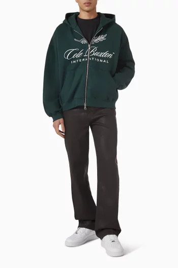 كنزة بغطاء رأس وسحّاب بشعار International