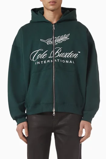 كنزة بغطاء رأس وسحّاب بشعار International