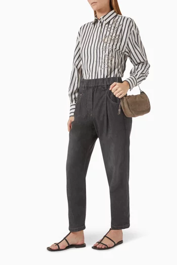 بنطال جينز بقصة تضيق باتجاه الحواف قطن