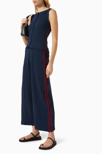 بلوزة بيتسي بأزرار بلا أكمام نسيج متشابك