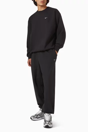 Solo Swoosh Cuffed Pants in Fleece