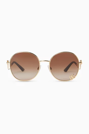 نظارة شمسية بتصميم دائري كبير وإطار معدن بلون ذهبي
