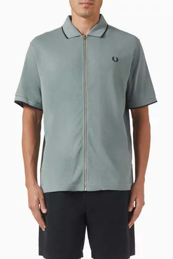 تي شيرت بولو بارز الملمس بسحّاب قطن