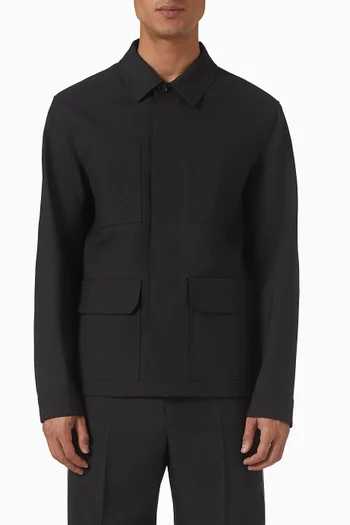 جاكيت صوف بأشرطة مضلعة