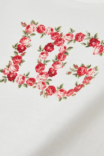 تي شيرت بطبعة زهور وشعار الماركة قطن