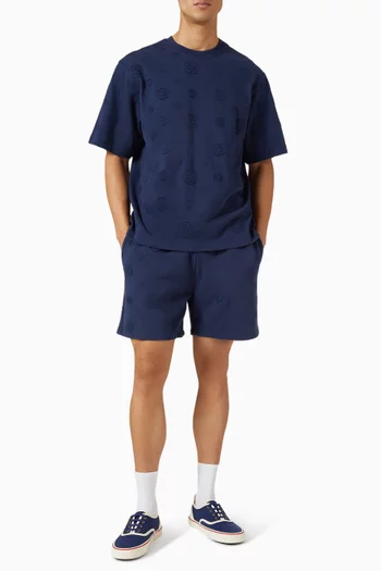 تي شيرت فضفاض برقعات بحروف الماركة قطن عضوي