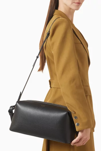 حقيبة صغيرة بريوش جلد بملمس حُبيبي