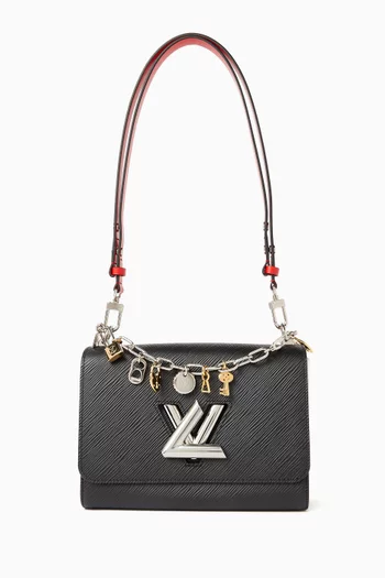 حقيبة تويست مزينة بحلي جلد