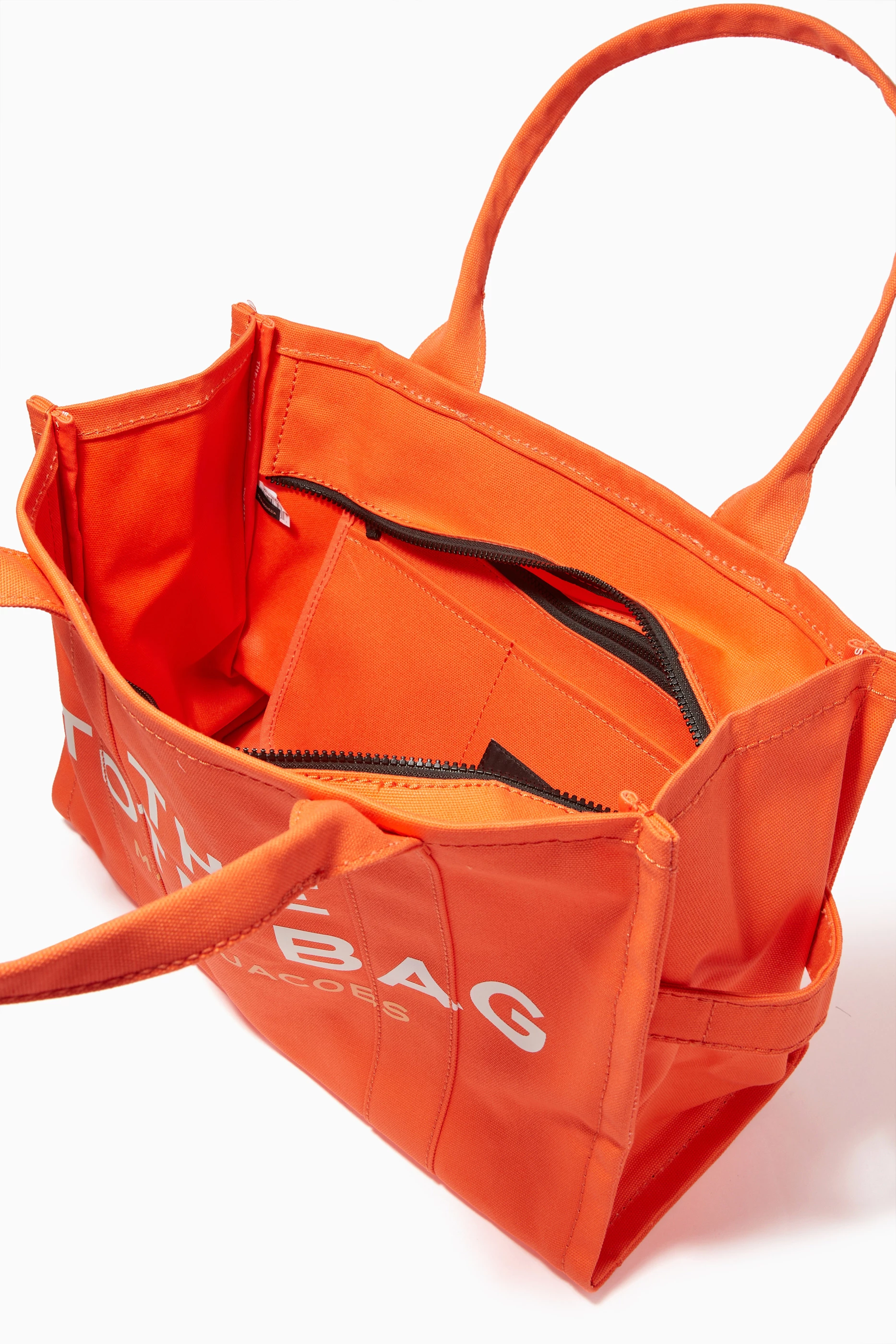 Buy Marc Jacobs Orange The Traveler Tote Bag in Canvas for Women