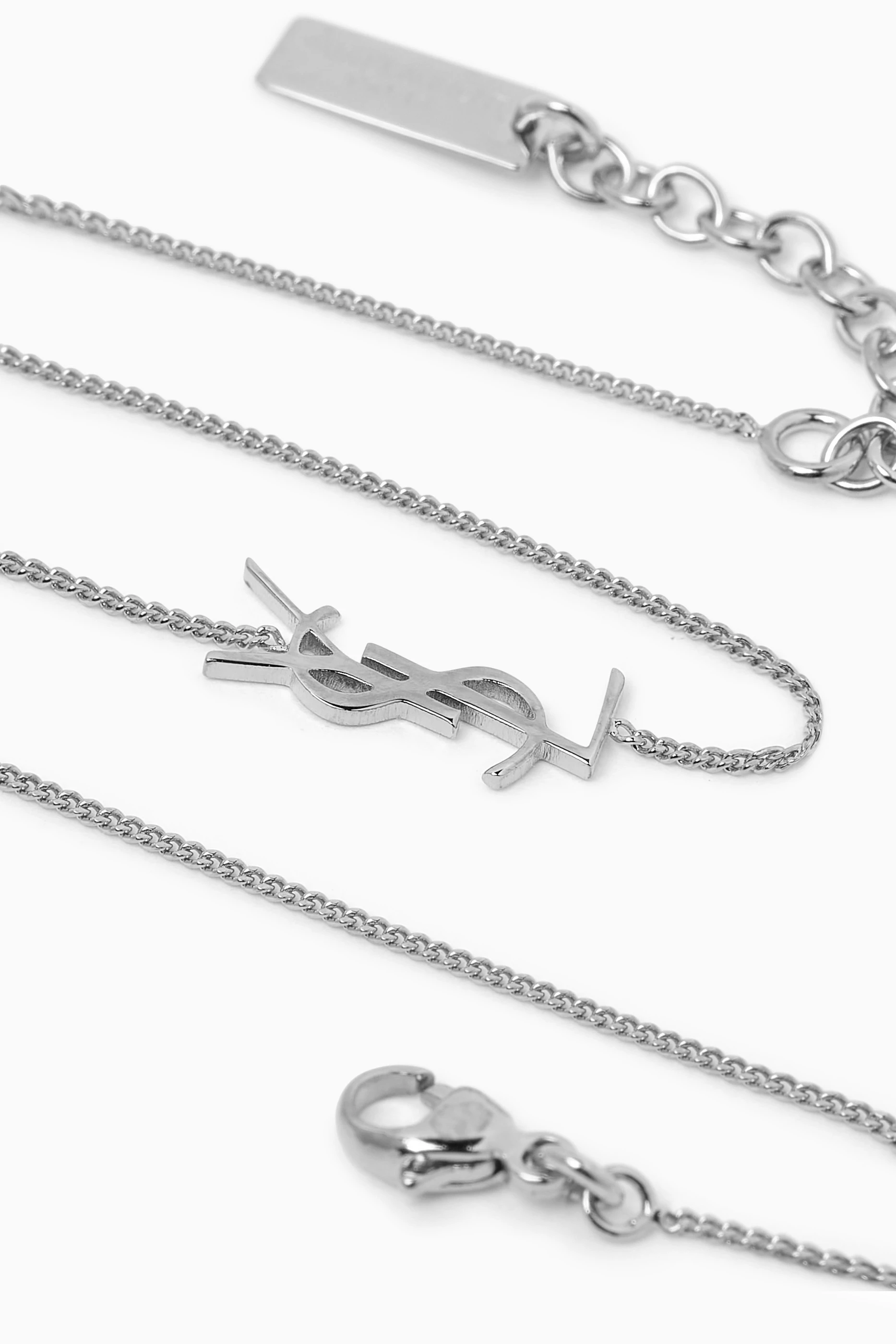 Saint laurent charm bracelet deals in silver brass