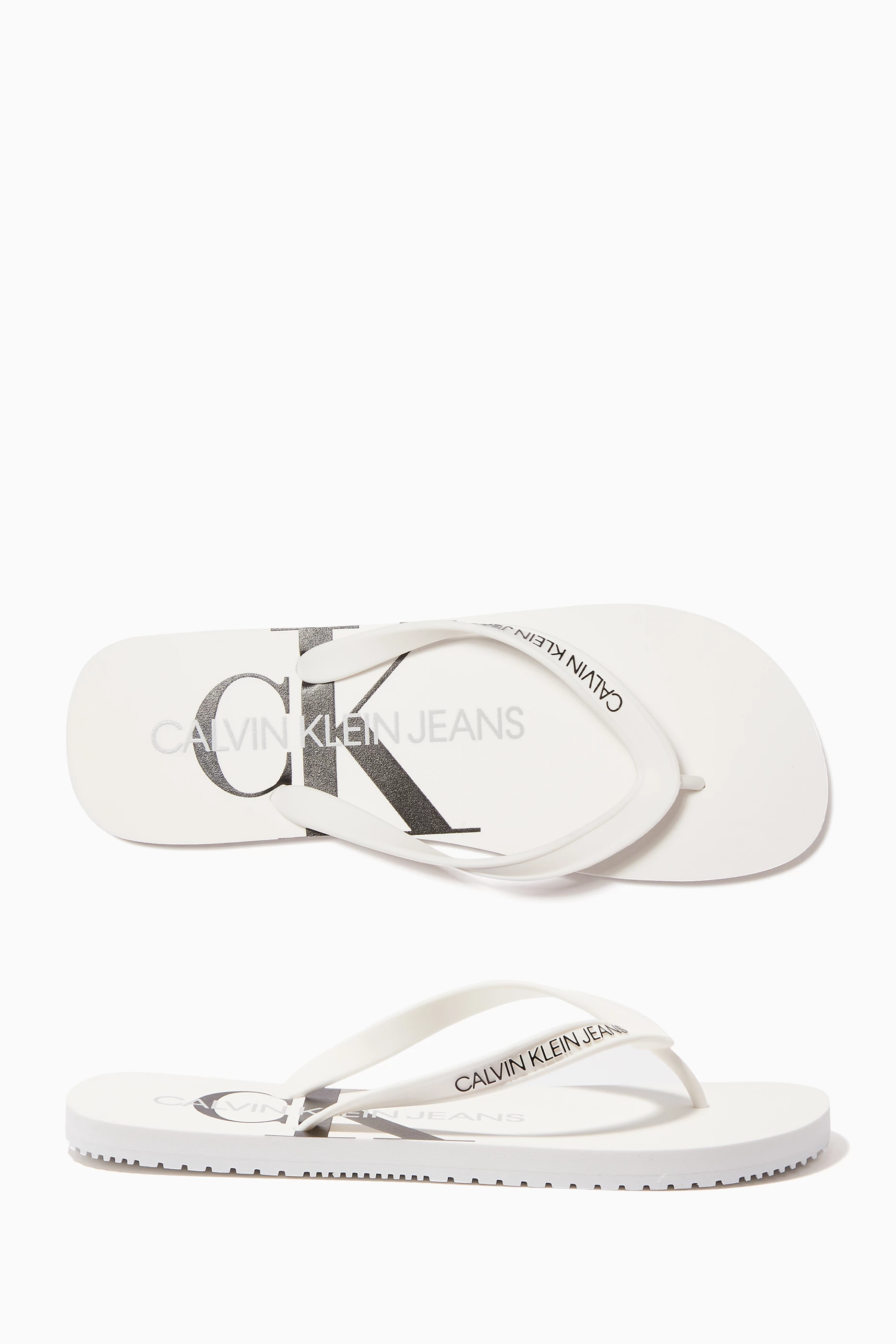 Buy Calvin Klein Jeans White Monogram Flip Flops for Men in UAE