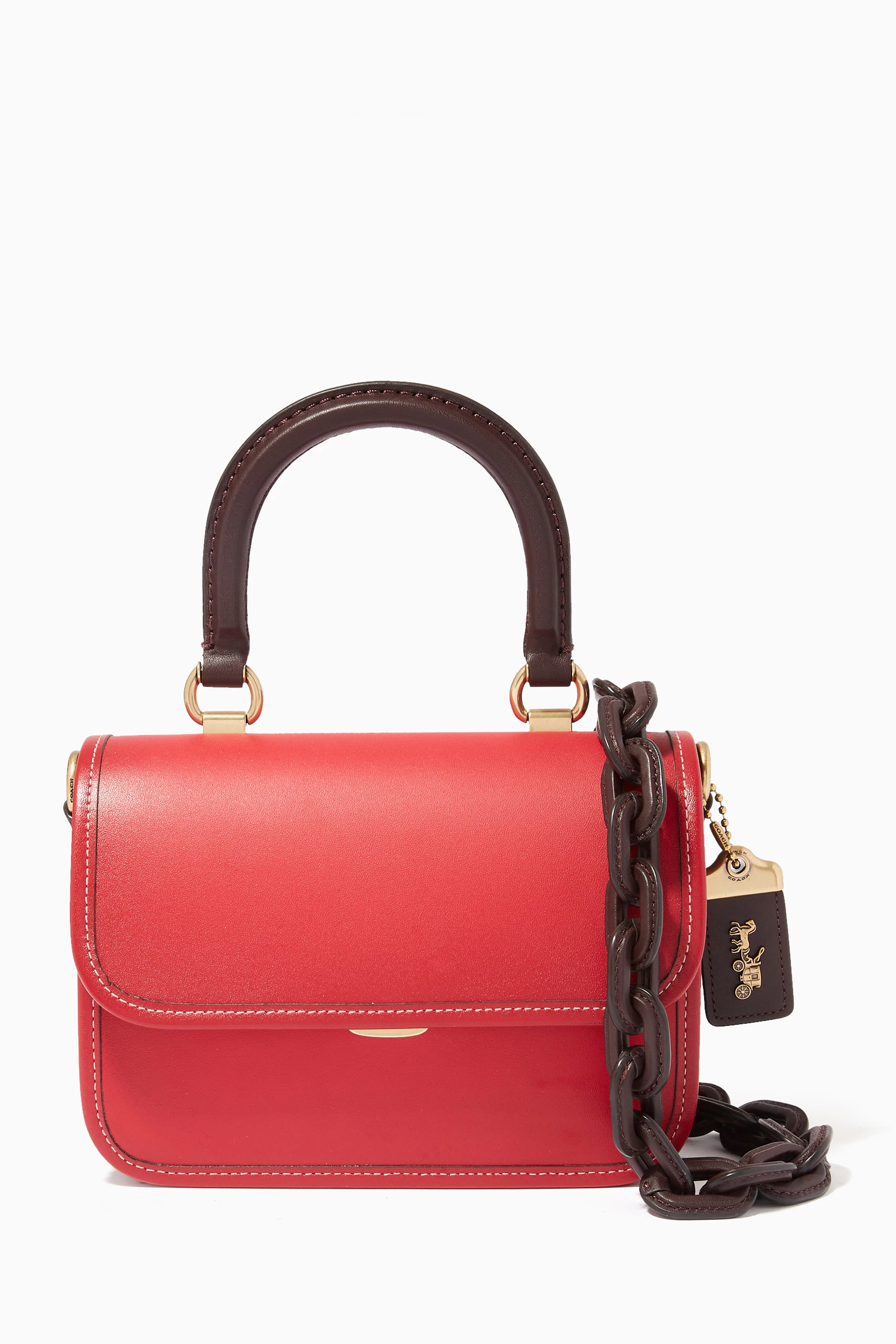 Coach bag with red handle top