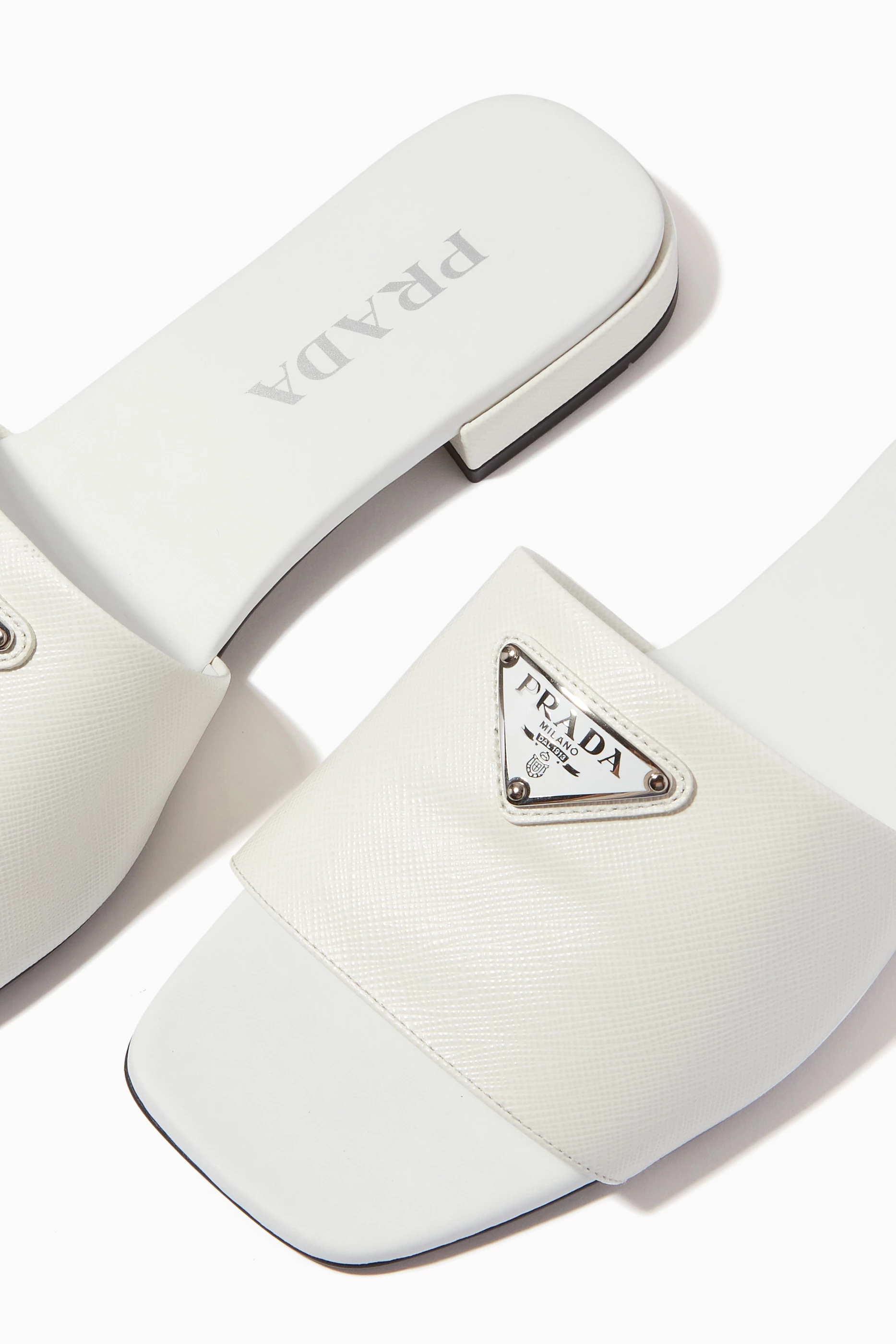 Buy Prada White Logo Enamel Mules in Leather for Women in UAE Ounass