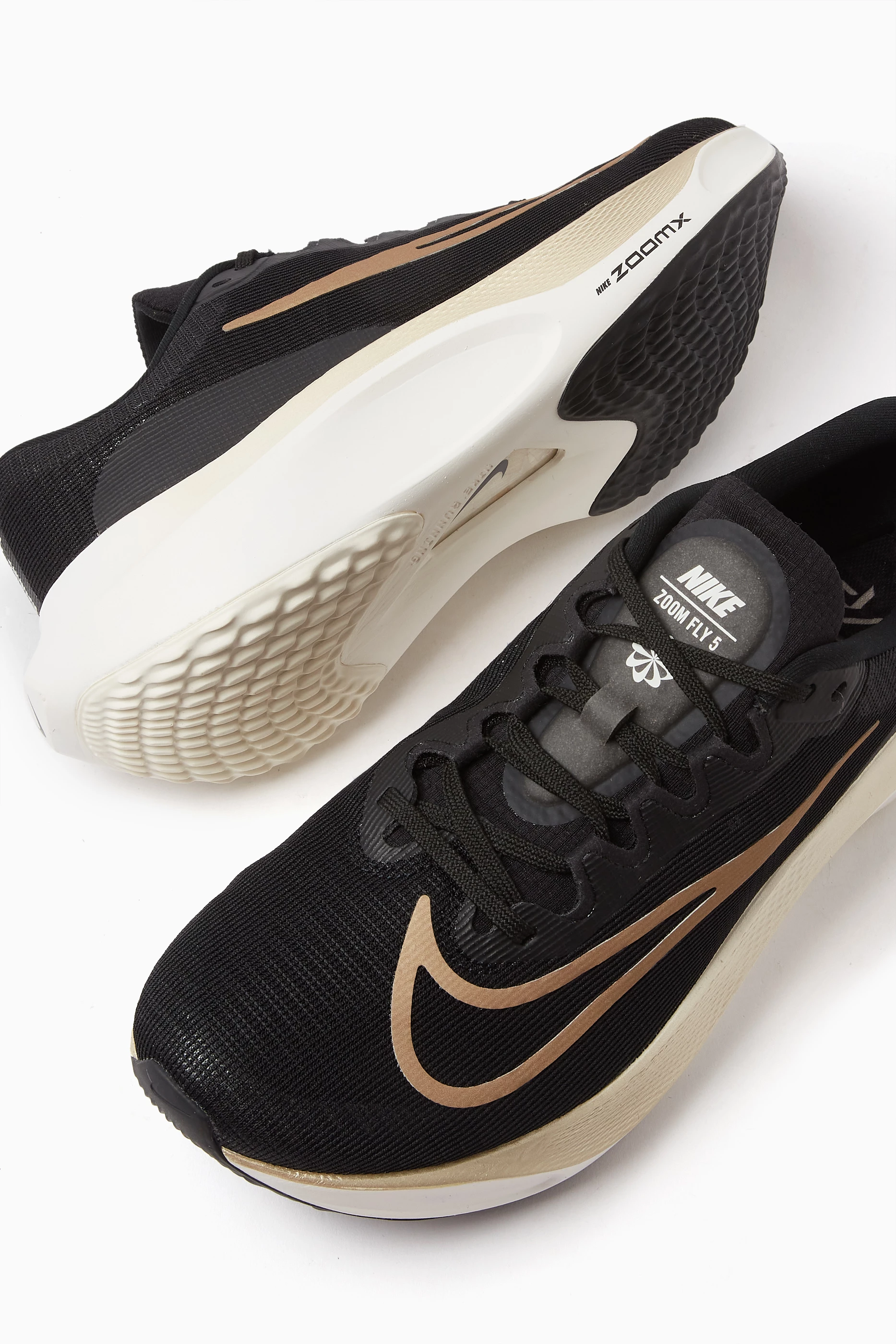 Nike zoom fly 2025 black white gold