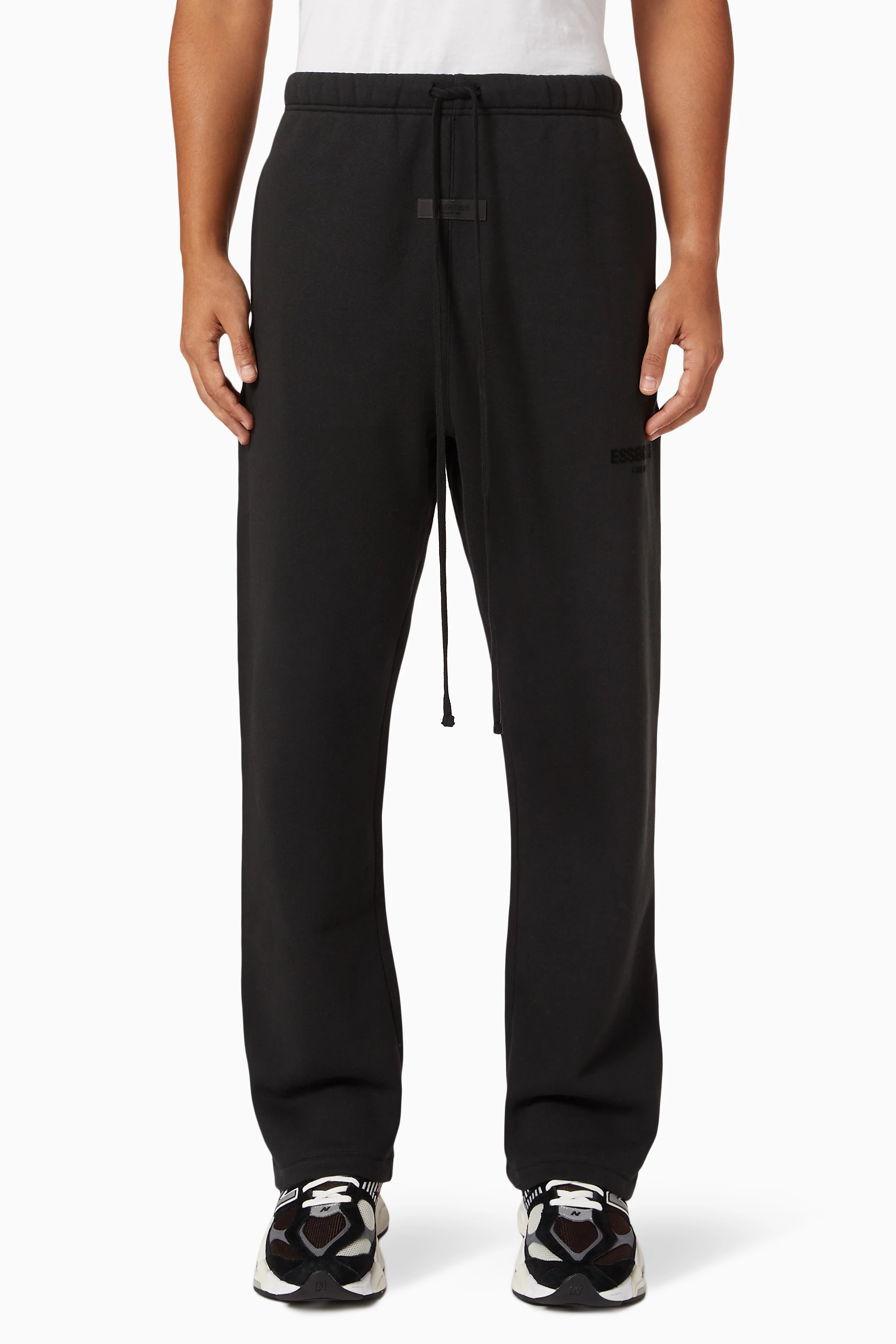 Buy Fear of God Essentials Black Relaxed Sweatpants in Fleece for