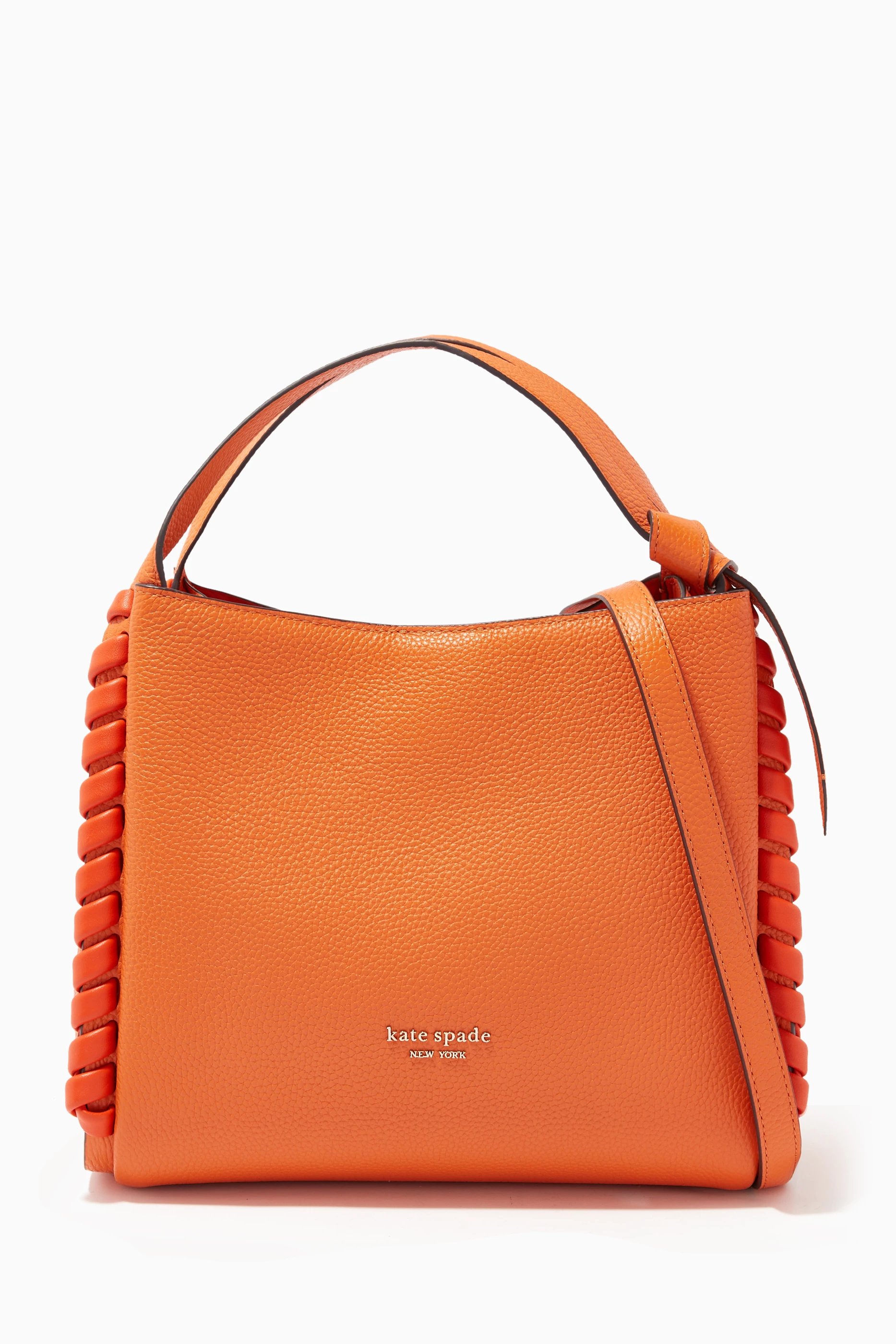 Orange leather store handbags and purses