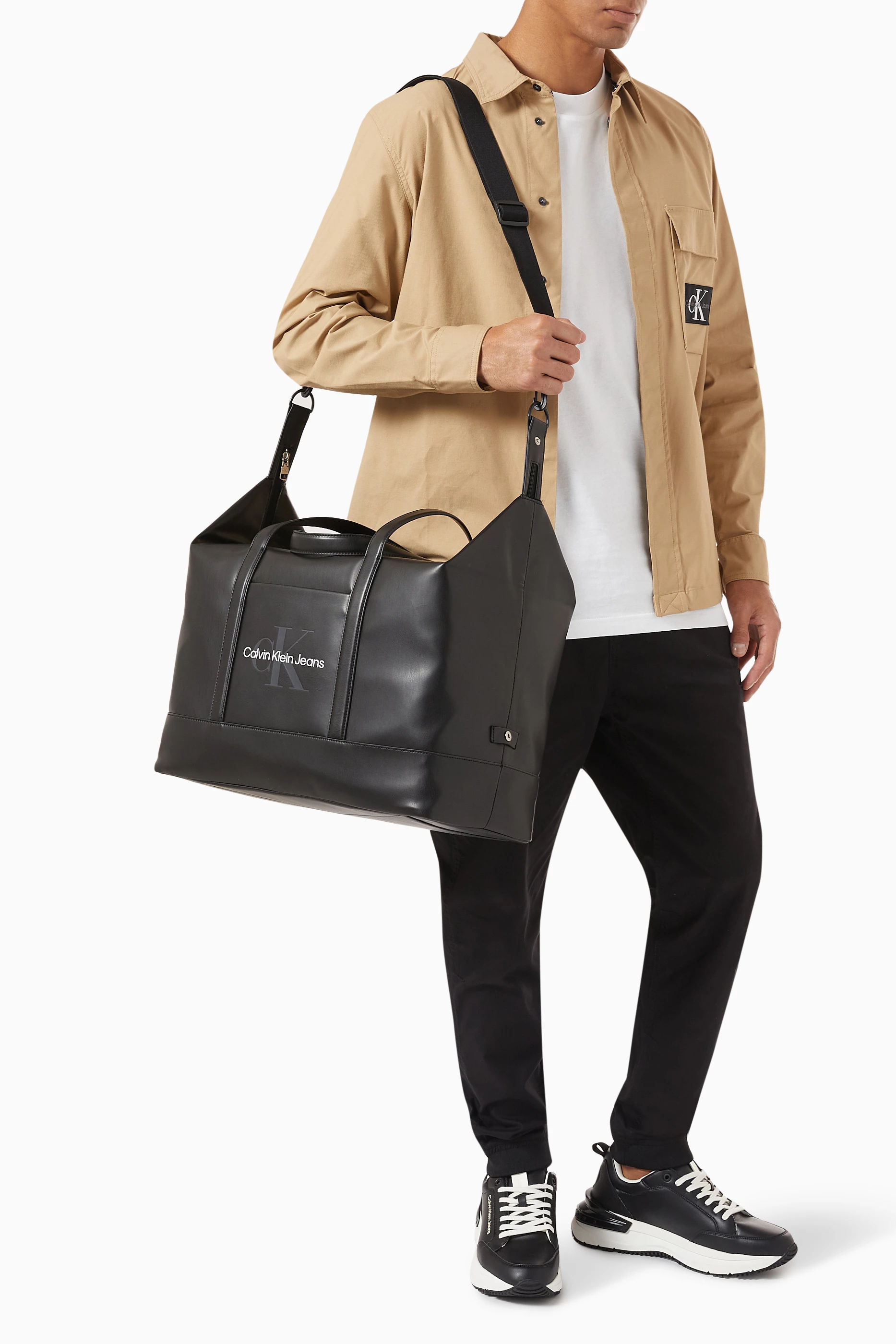 Calvin klein monogram duffle hot sale bag