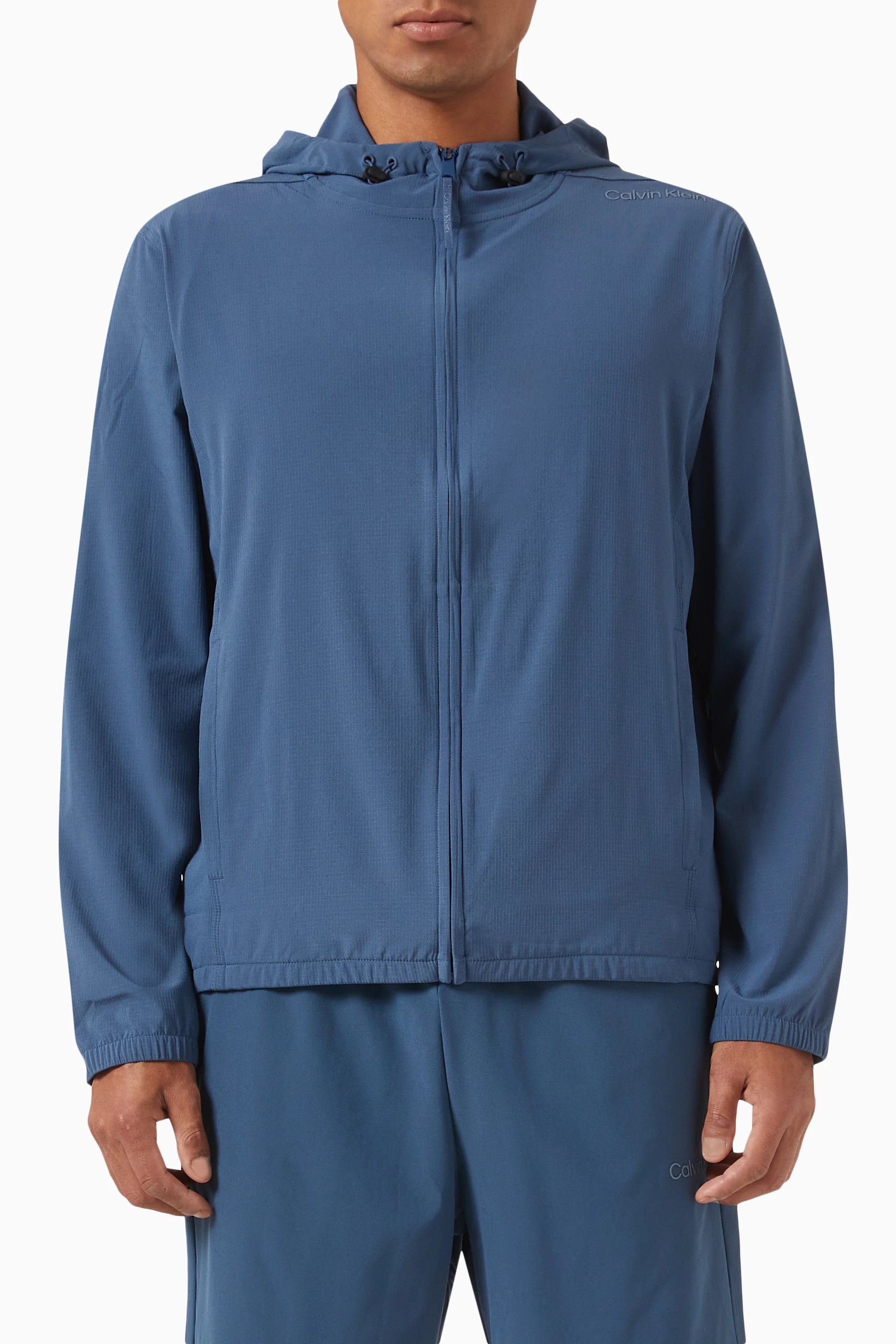 Buy Calvin Klein Performance Blue Hooded Windbreaker in Stretch Nylon for Men in UAE Ounass