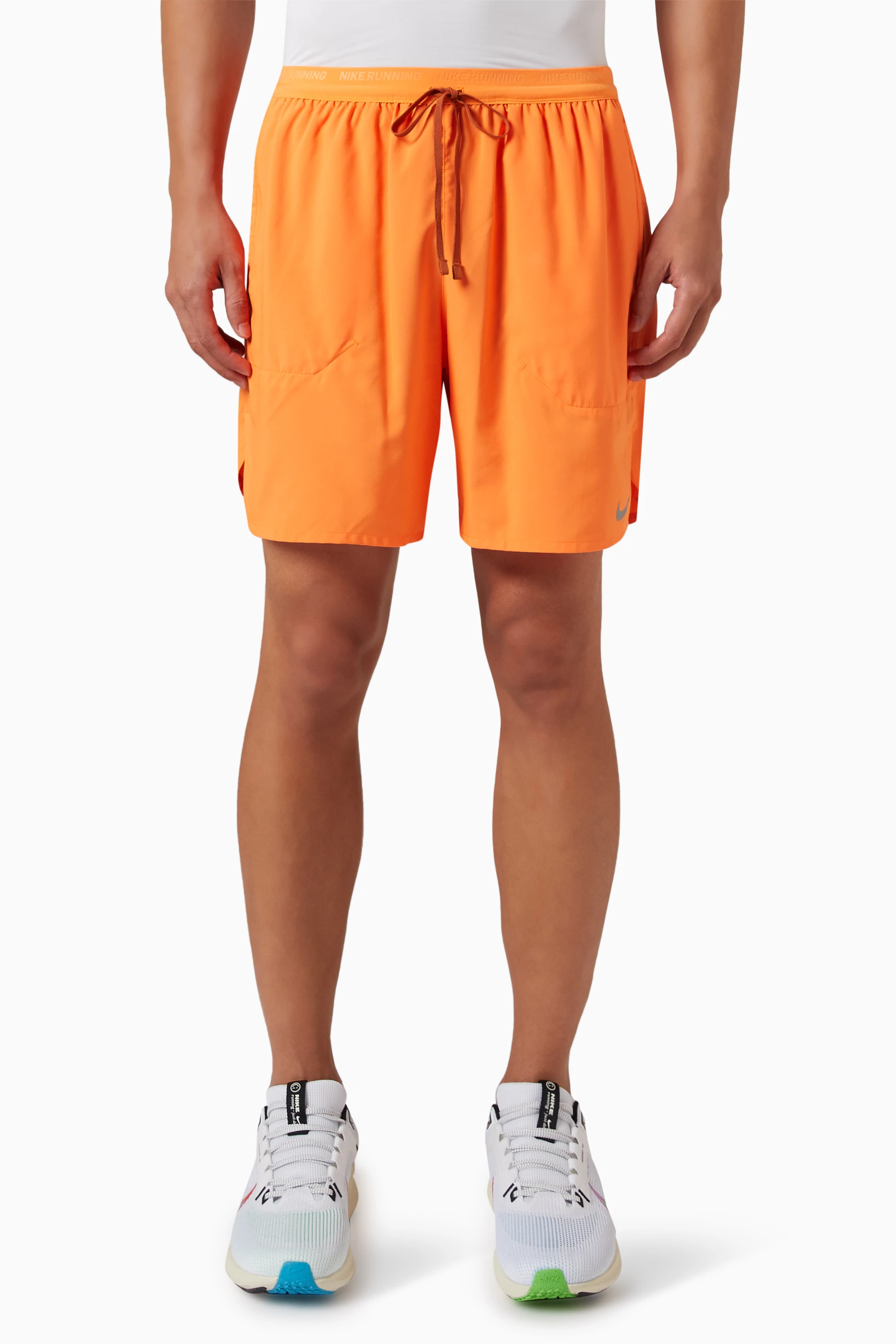 Orange nike running on sale shorts