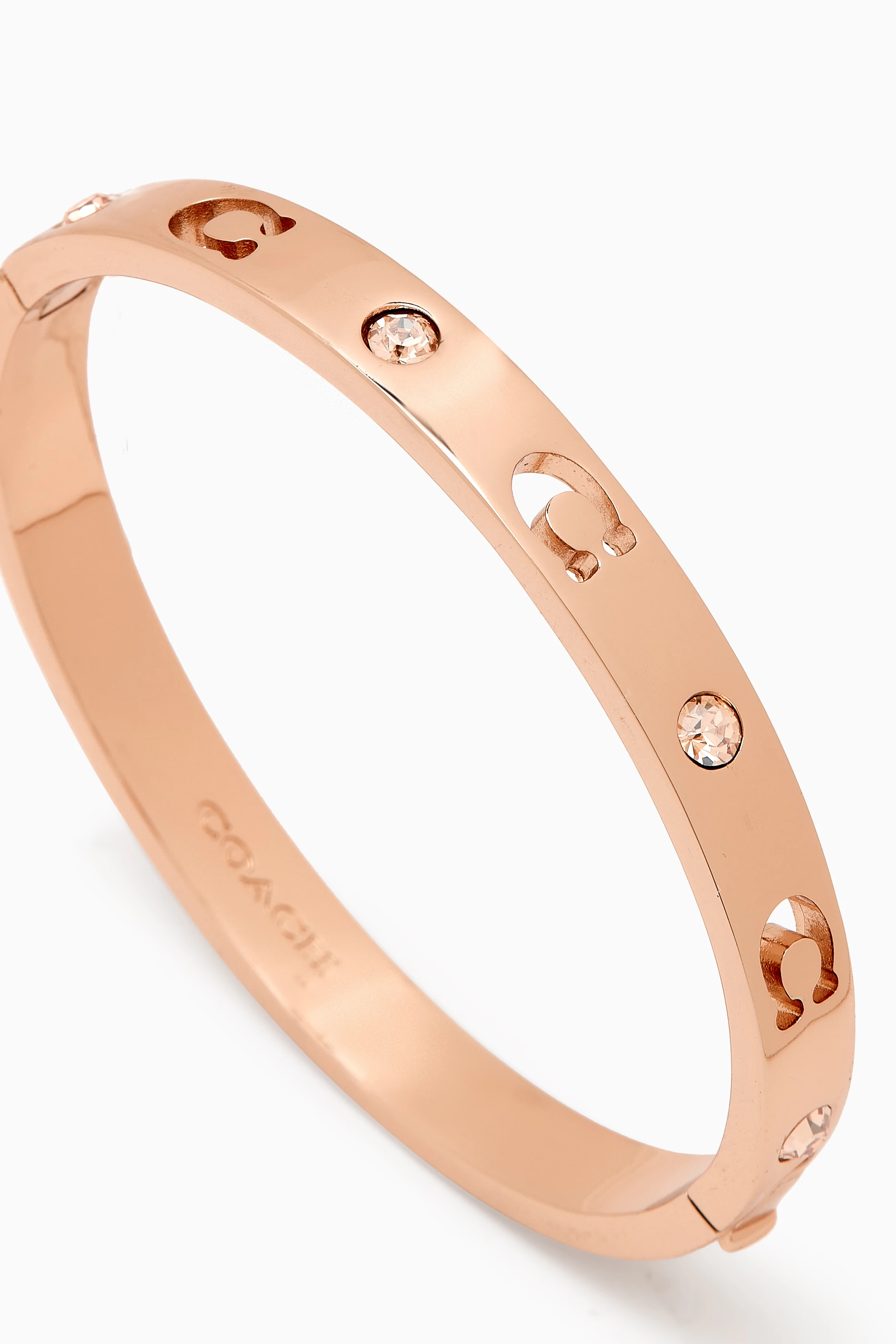 Buy Coach Rose Gold Signature Stone Hinged Bangle in Metal for