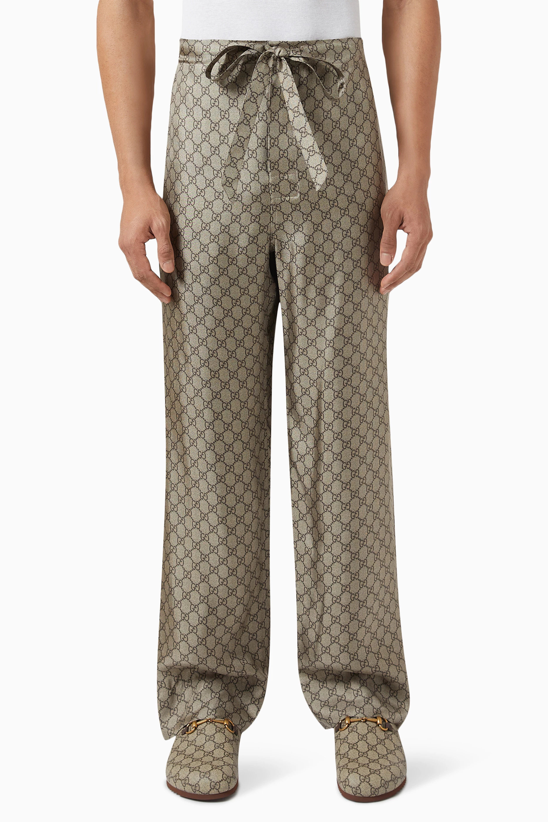 Buy Gucci Brown GG Supreme Print Trousers in Silk Twill for Men in