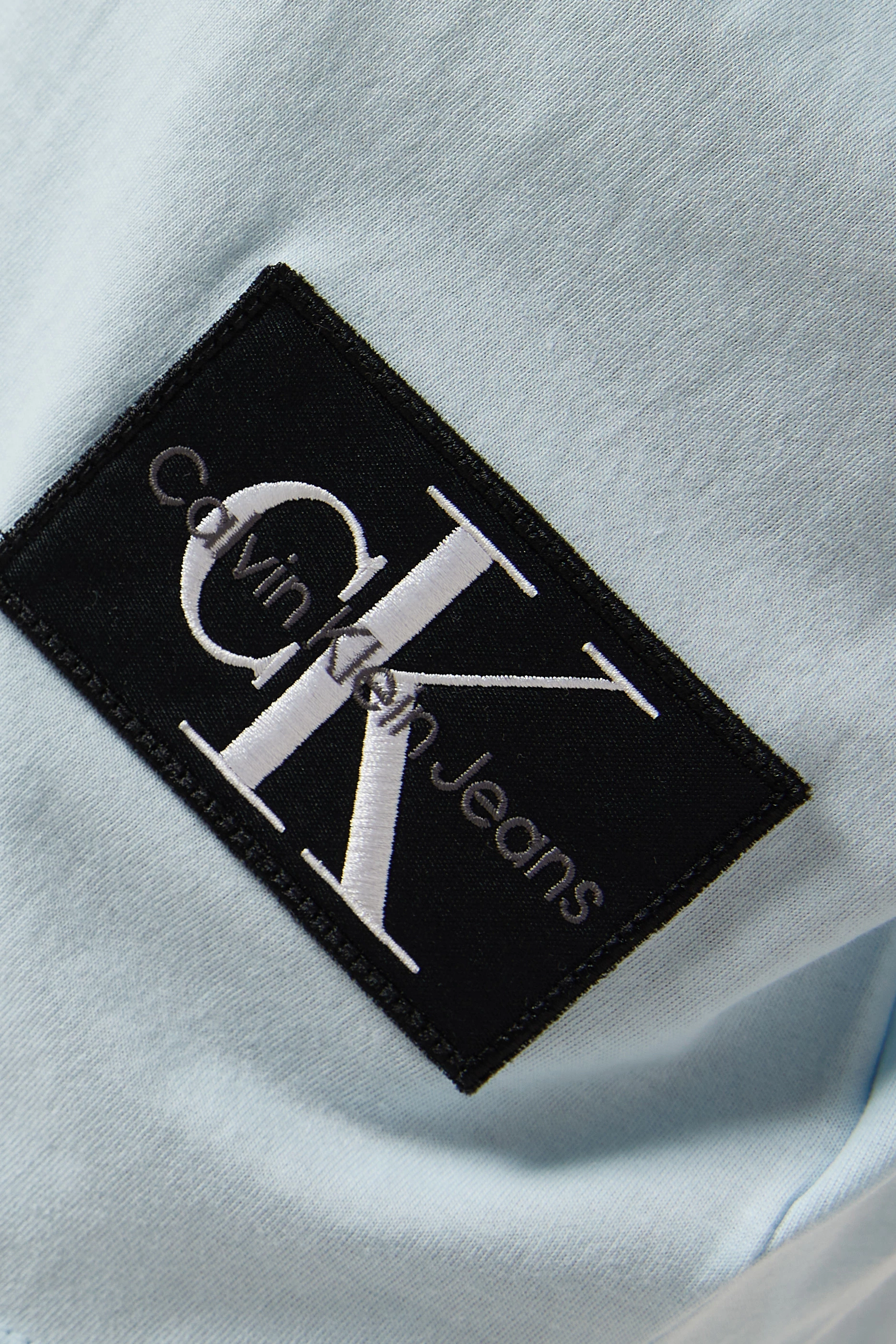 Buy Calvin Klein Jeans Blue Badge Turn up Sleeve T shirt in Cotton