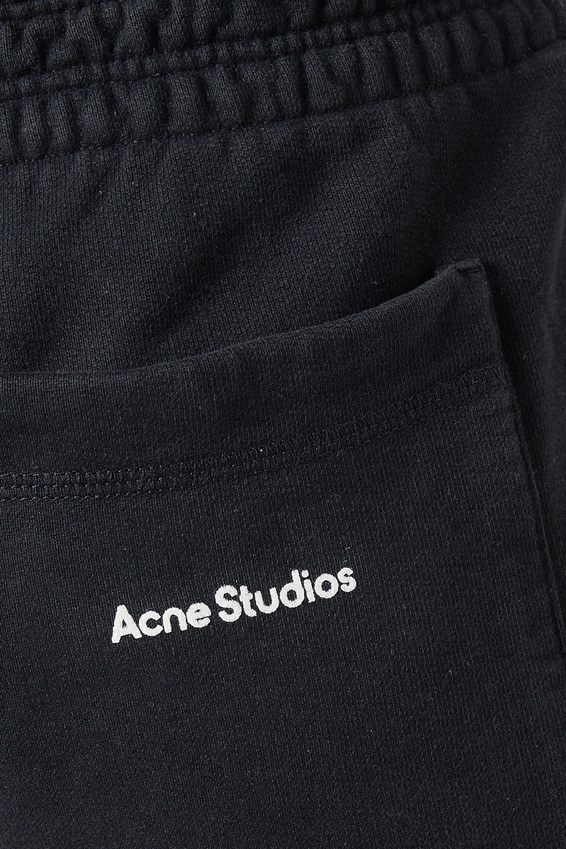 Black acne hot sale pants