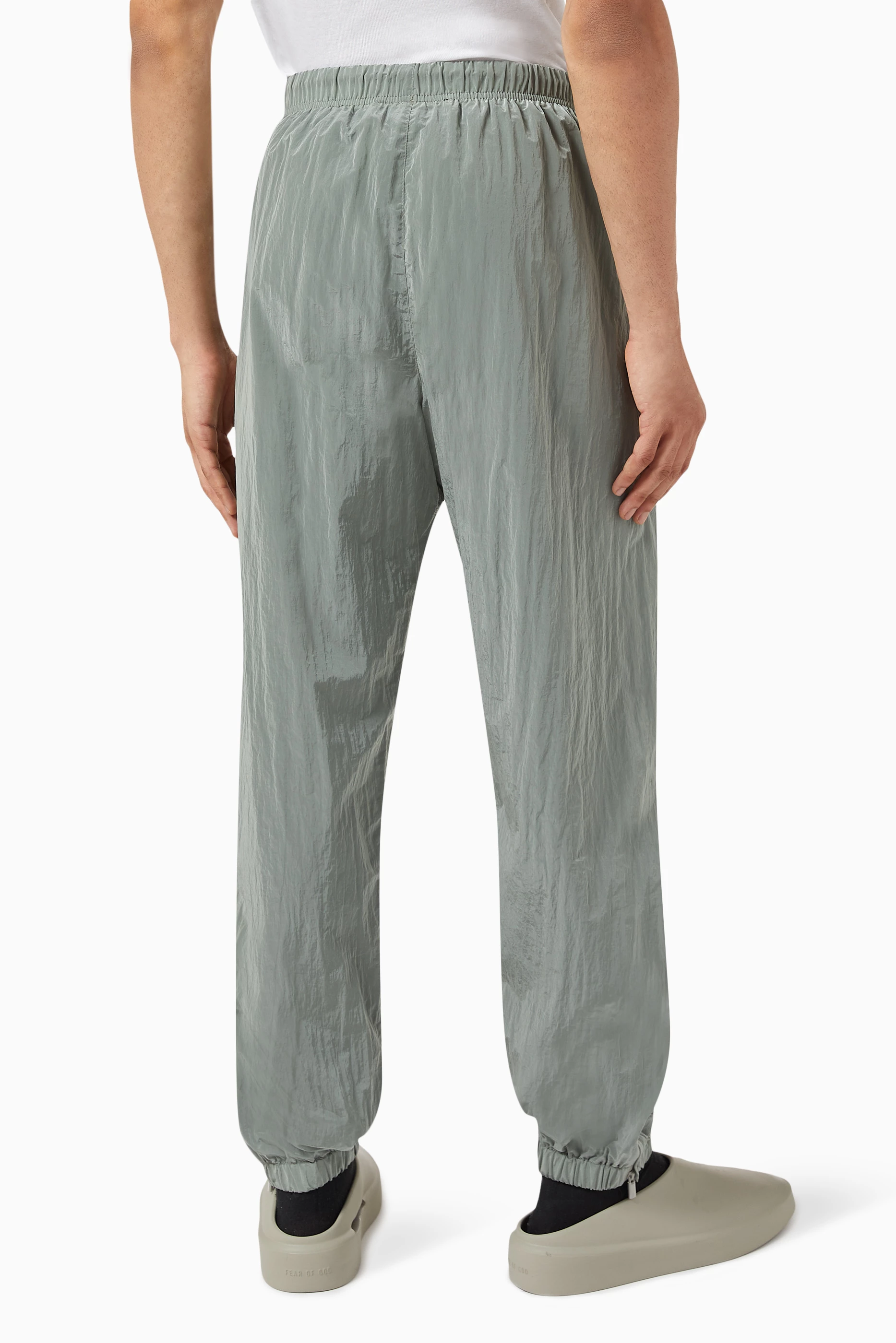 Buy Fear of God Essentials Grey Logo Trackpants in Crinkle Nylon