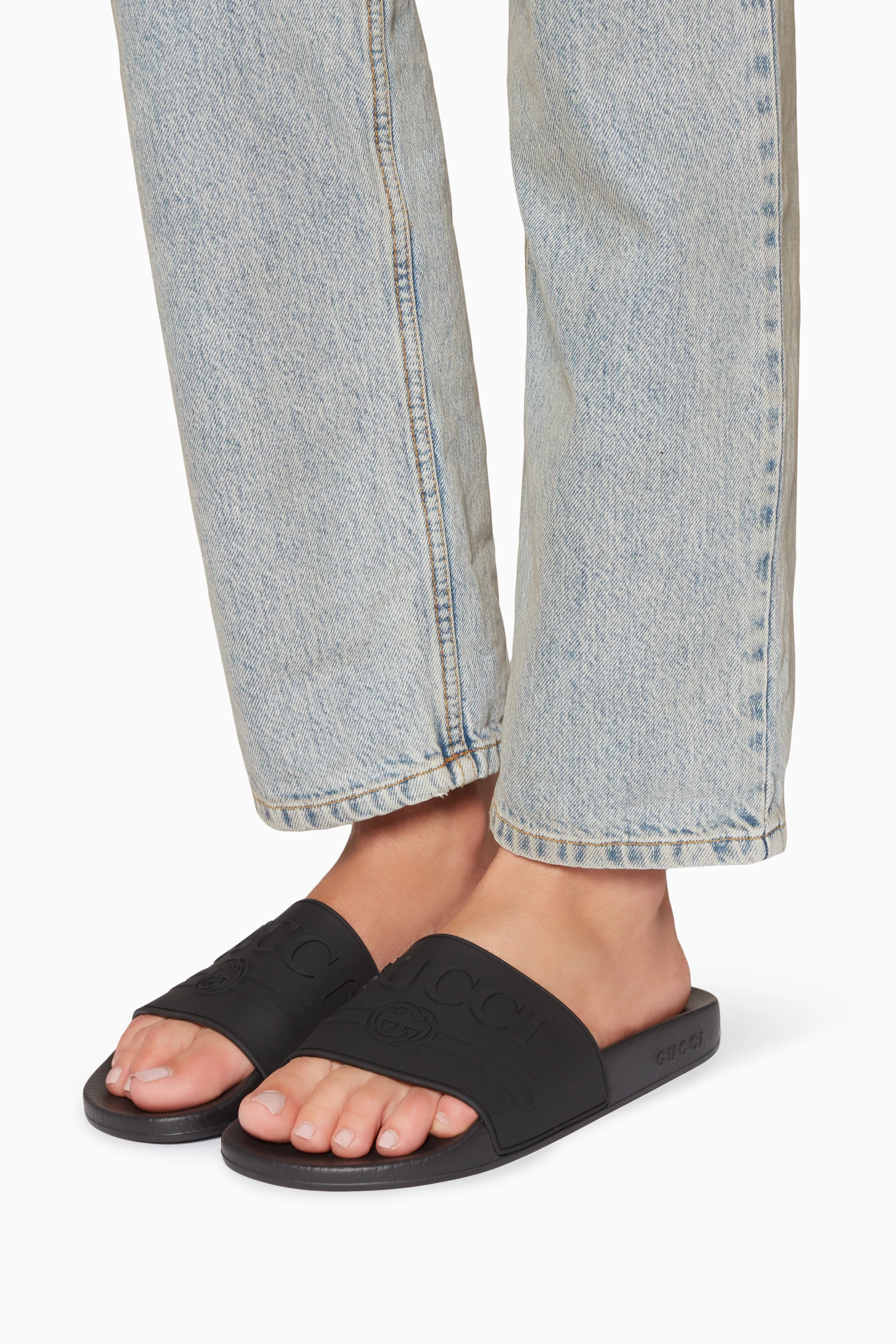 Gucci embossed slides top