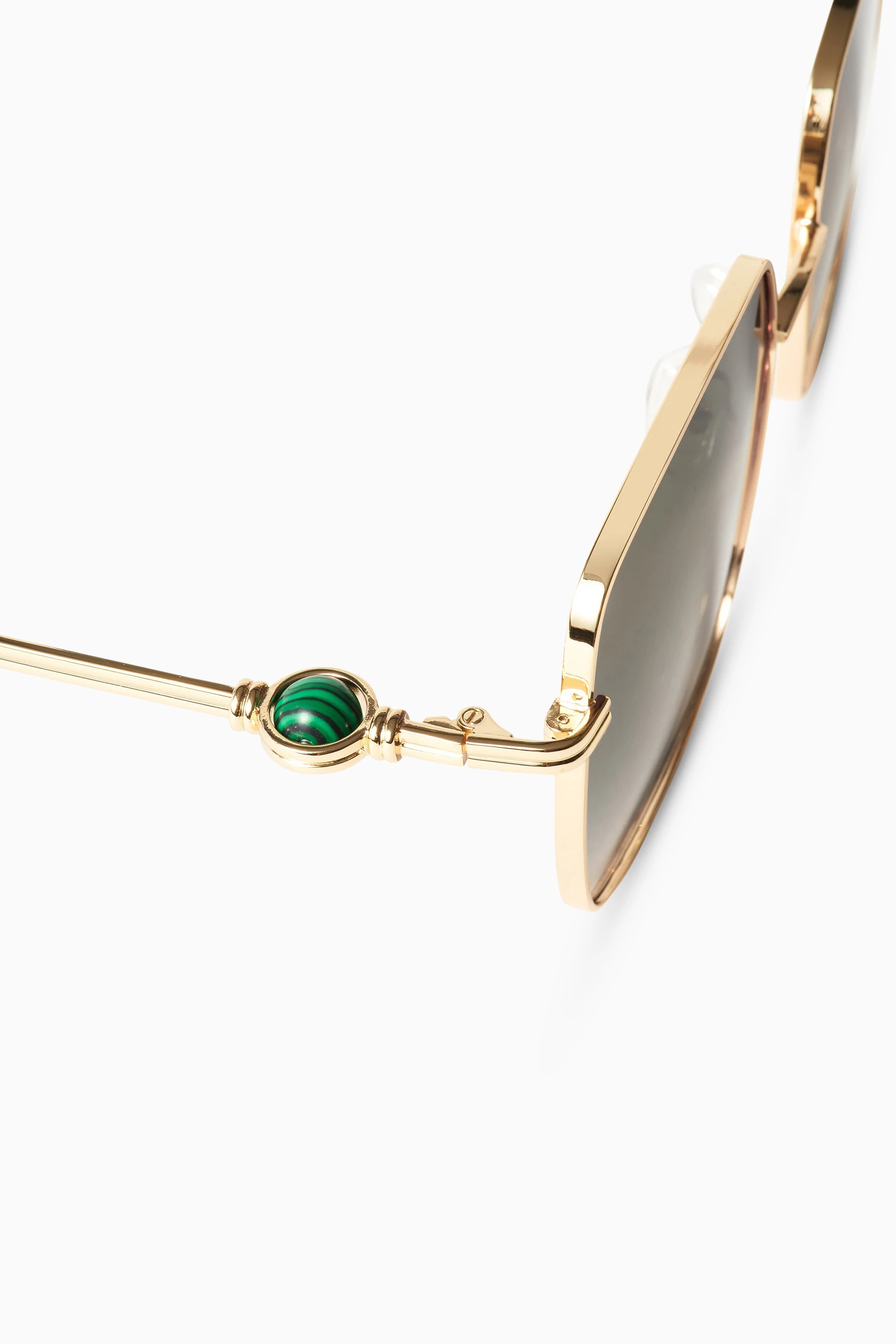 Buy Le Specs Gold x Missoma Aquarius Sphere Sunglasses in 