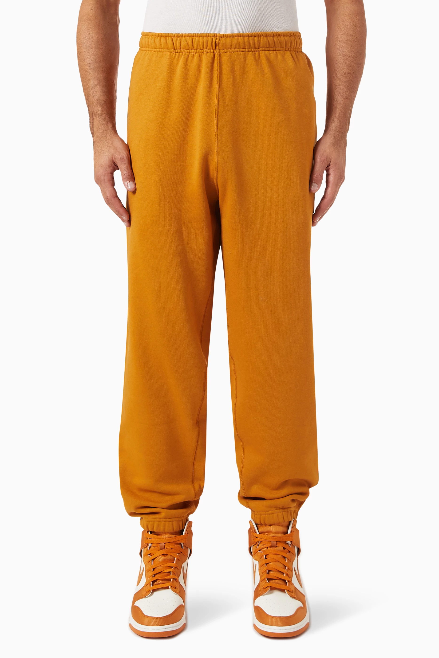 Buy Nike Yellow Nike Solo Swoosh Trousers in Cotton blend Fleece For Men Online Ounass UAE