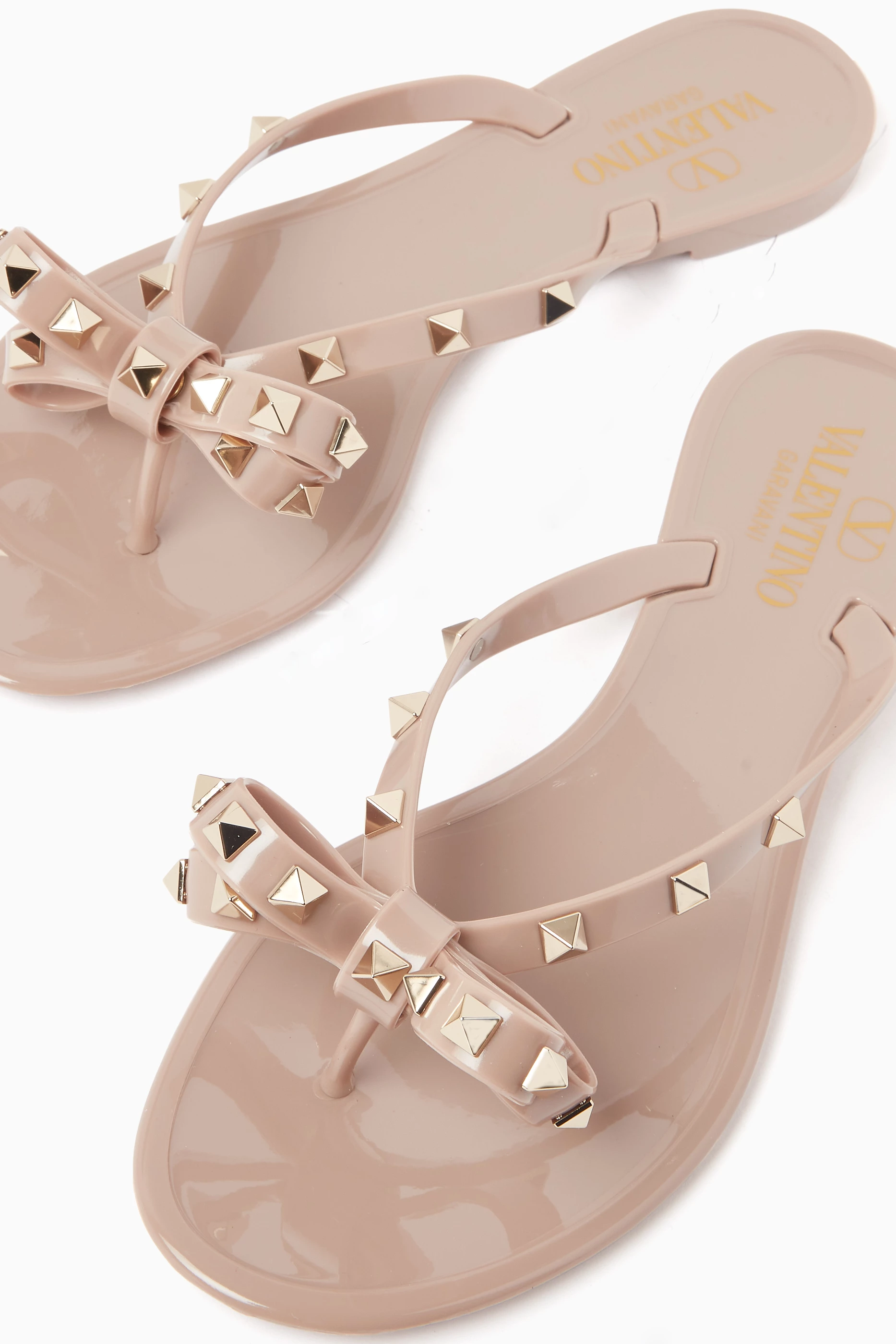 Buy Valentino Garavani Neutral Valentino Garavani Rockstud Flip Flops in PVC For Women Online Ounass UAE