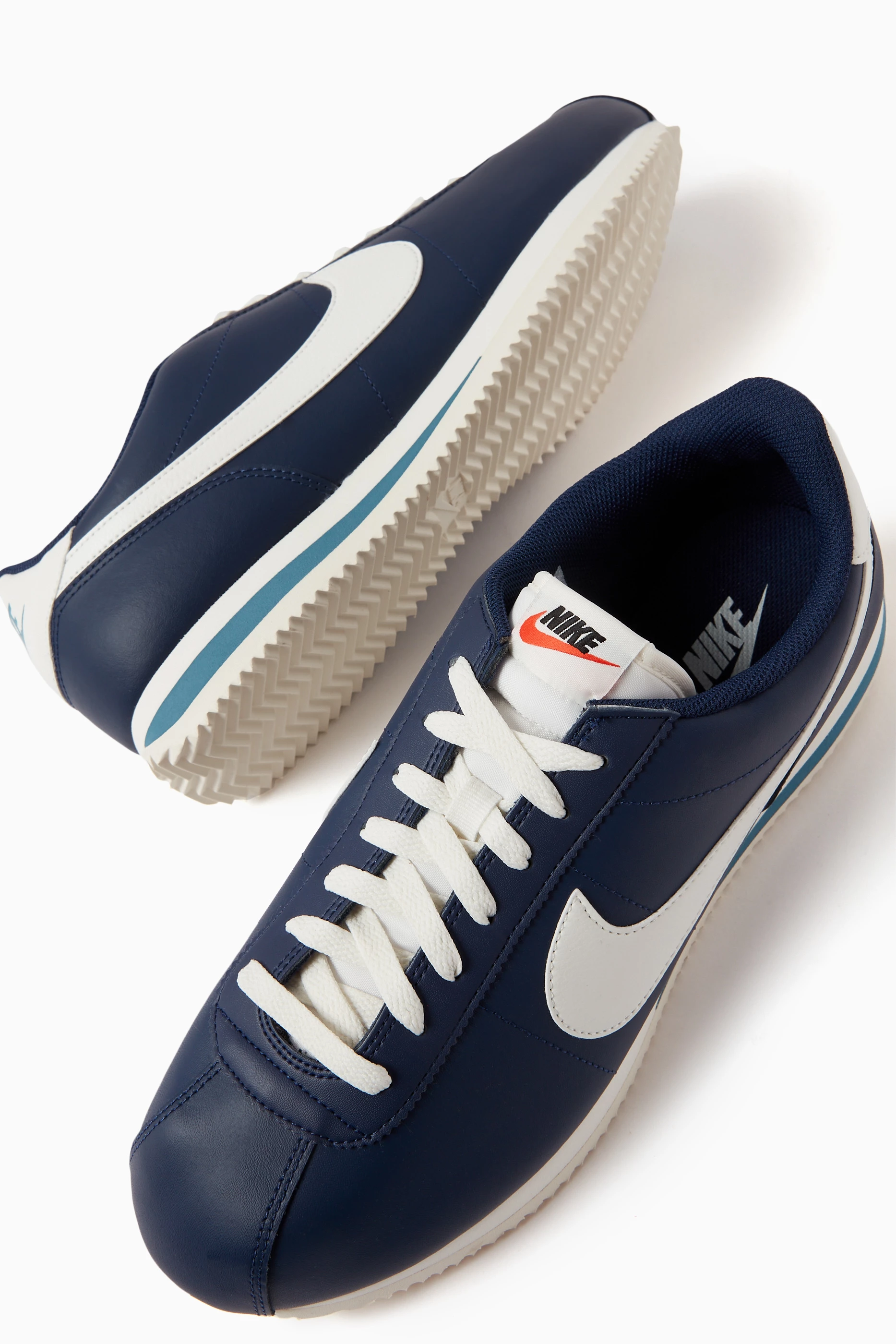 Navy blue leather cortez sales